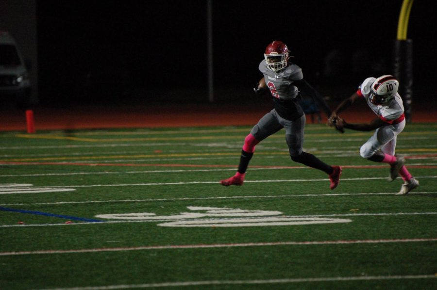 Freshman Kentrell White breaks a defenders tackle to return a punt on Senior night against Stone Mountain on Oct. 28.