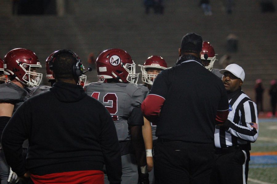 Head Coach Darrell Howard coaching the offensive line against Stone Mountain on Oct. 28.
