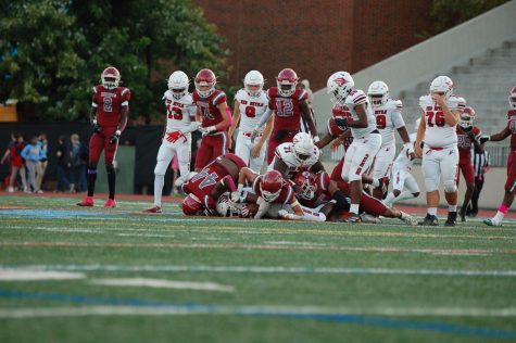 A dogpile over the ball between the Knights and Red Devils takes place on Oct. 7.