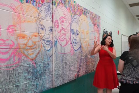 At Inman Elementary school, teaching artist Yehimi Cambrón presents the mural she made through collaboration with art from the students.