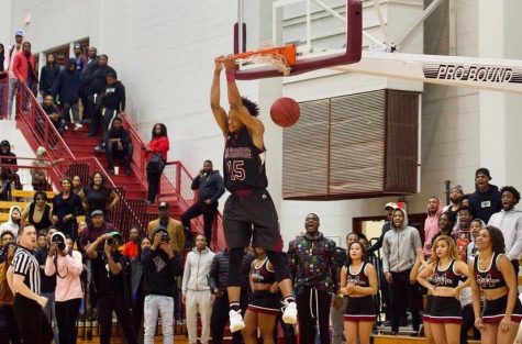 Martravious Little dunks during one of his collegiate basketball games at Morehouse College.