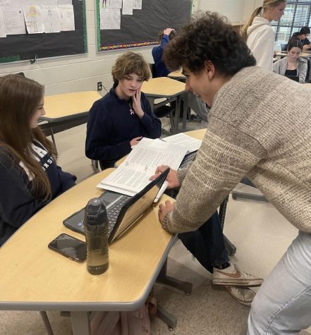 Co-captain Jonas Loesel instructs new student, Jackson Canbob. They refer to the novices as grapes, and experiences students as raisins. Mock trial is a student-led club, and seniors often instruct underclassmen.