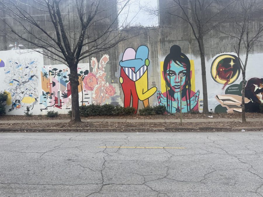 Yoyo Ferro, along with other Atlanta muralists, have painted murals for the Forward Warrior 2019 event that span a half mile in the Cabbagetown neighborhood.