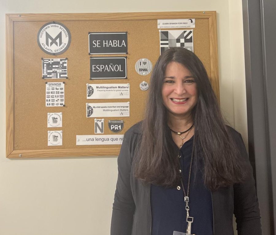 Nydia Rivera stands outside her office. As the  Bilingual Community Engagement Specialist, she helps connect with families and students who speak English as a second language.