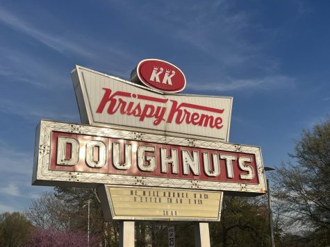 At the Krispy Kreme on Ponce de Leon Avenue, the sign reads We will bounce back better than ever-Shaq. The store plans to reopen this summer.