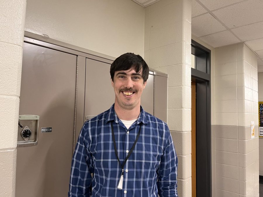 Mr. Mohney allows his students move freely around the classroom and hallways to create a good instructive environment. Here he comments and helps students working on individual assignments right outside his classroom door. 