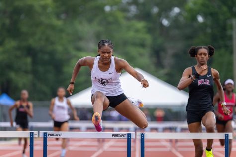 Sophomore Danayja Harper clears the hurdle during her 300 meter hurdles race, setting a school record and placing first in the state meet with a time of 42.19, ranking her 20th in the 300 hurdles in the United States.