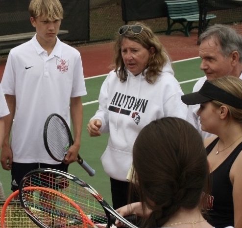 Coach Taylor motivates her team ahead of a match, Taylor was the Boy tennis coach for around 20 years