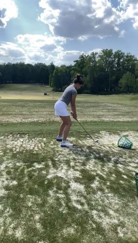 Williams practices at the driving range to build skills for her competition.