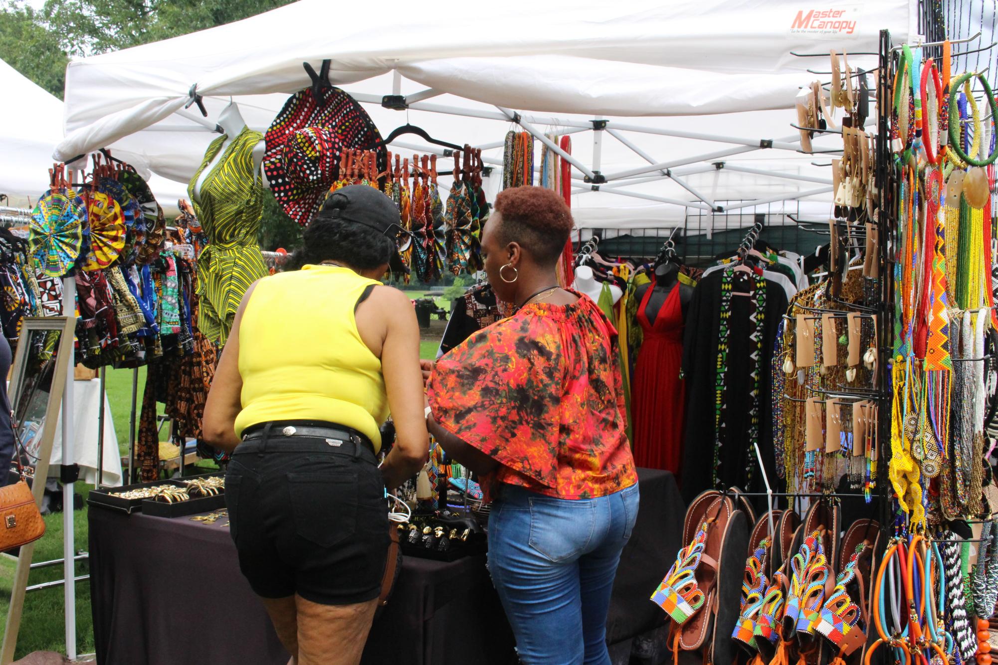 Business owner, Beth Mbuthye, showcases authentic African goods at her booth. 
