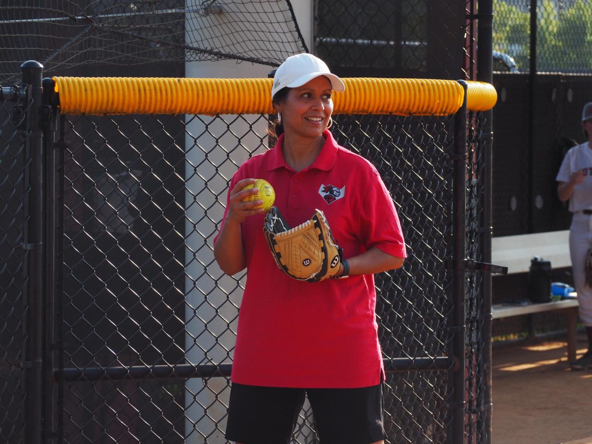 Business teacher Cruz joins team as softball assistant coach