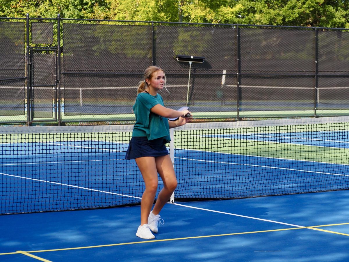 Senior+Olivia+Allen+swings+through+the+ball+during+a+monthly+pickleball+meeting+at+Piedmont+Park+on+Sept.+28.