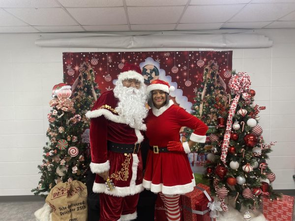 Joseph Richburg, (left) Jack and Jill of America member, as Santa, Kimberly Bell, Jack and Jill chapter president, as Mrs. Claus, at the Breakfast with Santa event on Dec. 9 at the Andrew and Walter Young YMCA in Southwest Atlanta