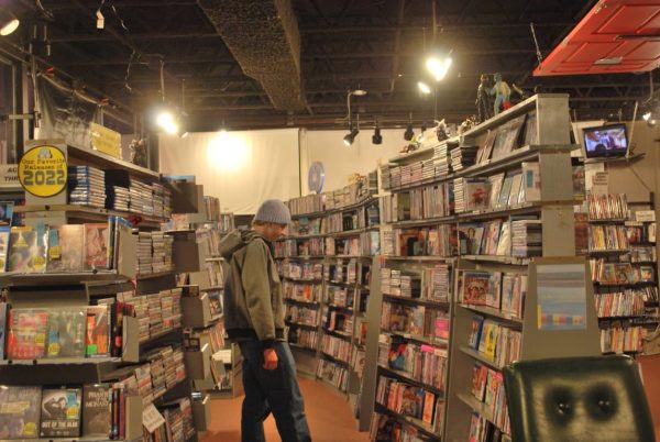 Sophomore Tate Mikula browses DVDs at Videodrome. 