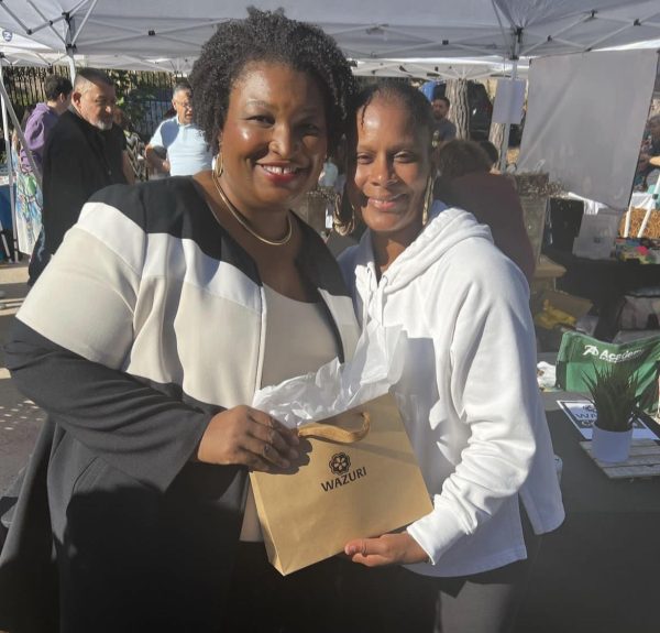 Wazuri Cosmetics owner Charlene Wilhelmsen poses with politician Stacey Abrams at the Atlanta Arab Festival.