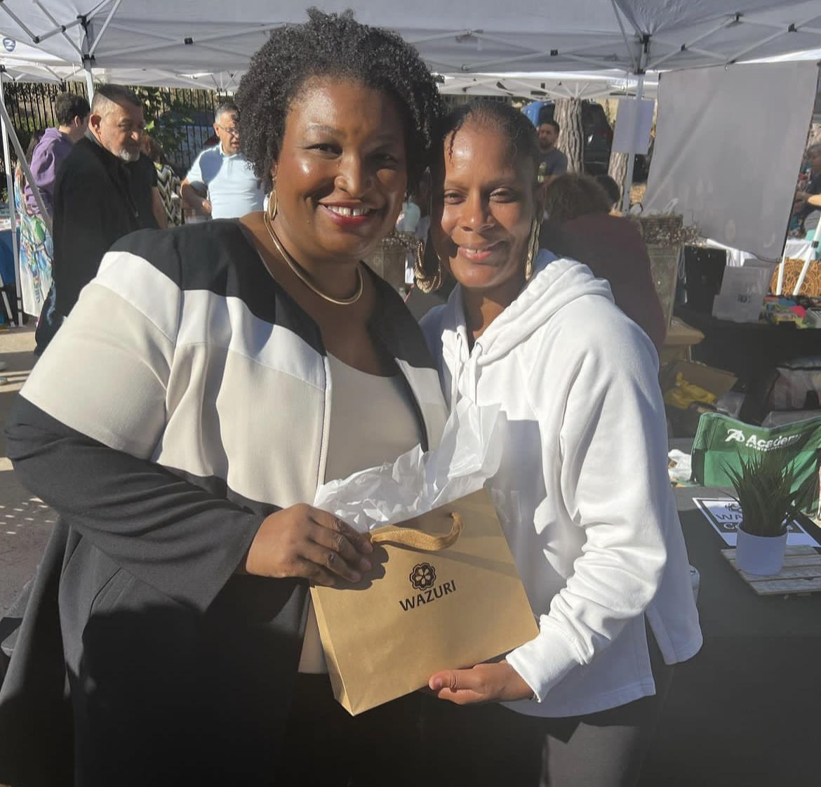 Wazuri+Cosmetics+owner+Charlene+Wilhelmsen+poses+with+politician+Stacey+Abrams+at+the+Atlanta+Arab+Festival.