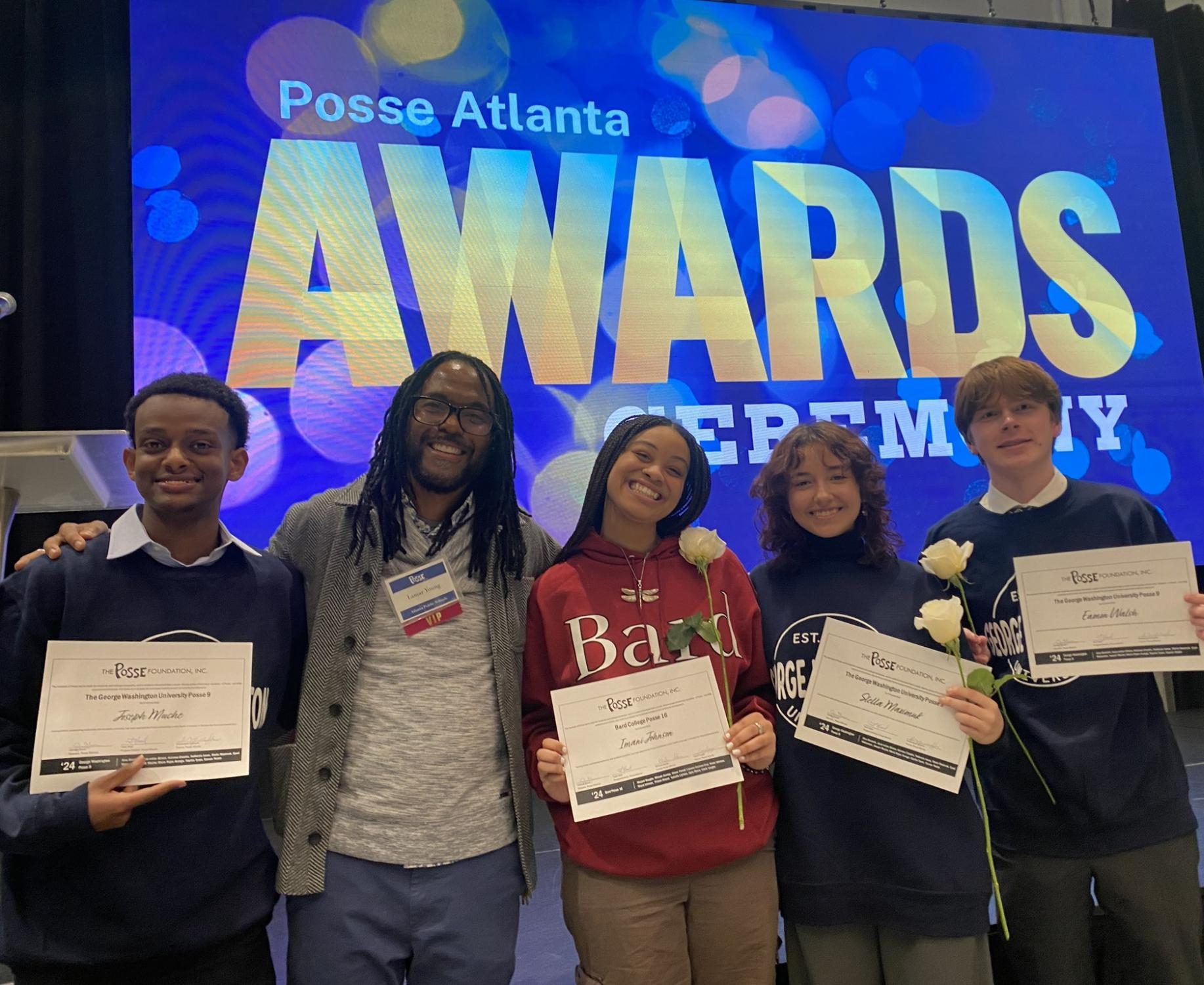 From left to right: Senior Joe Muche, Counselor Lamar Young, Seniors Imani Johnson, Stella Maximuk and Eamon Walsh smile after receiving their official Posse Scholarship certificate.