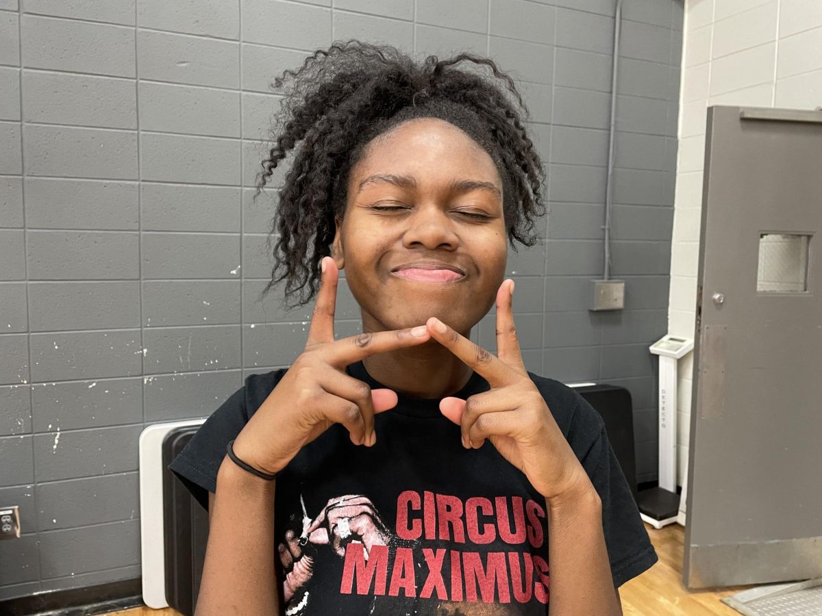 Freshman Neveah Hambrick smiles at the end of basketball practice. 