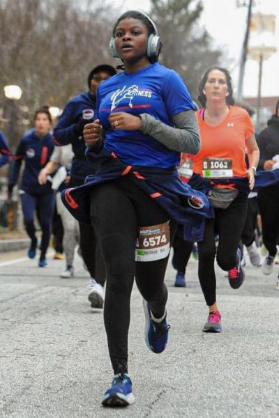Junior Melina Welch runs in one of her fitness groups more recent runs, the Hot Chocolate Run. Welch describes the community she’s found through running as the most rewarding part of a 5k race.