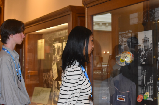 During a long day of talking to lawmakers about Advanced Placement (AP) equity for students and representing Midtown at the Georgia Capitol, sophomores Grant Stearsman (left) and Ryan Butler (right) admire the historical artifacts displayed next to the Senate floor. 
