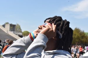 Students used provided glasses to look at the changes in the sun during the solar eclipse. 