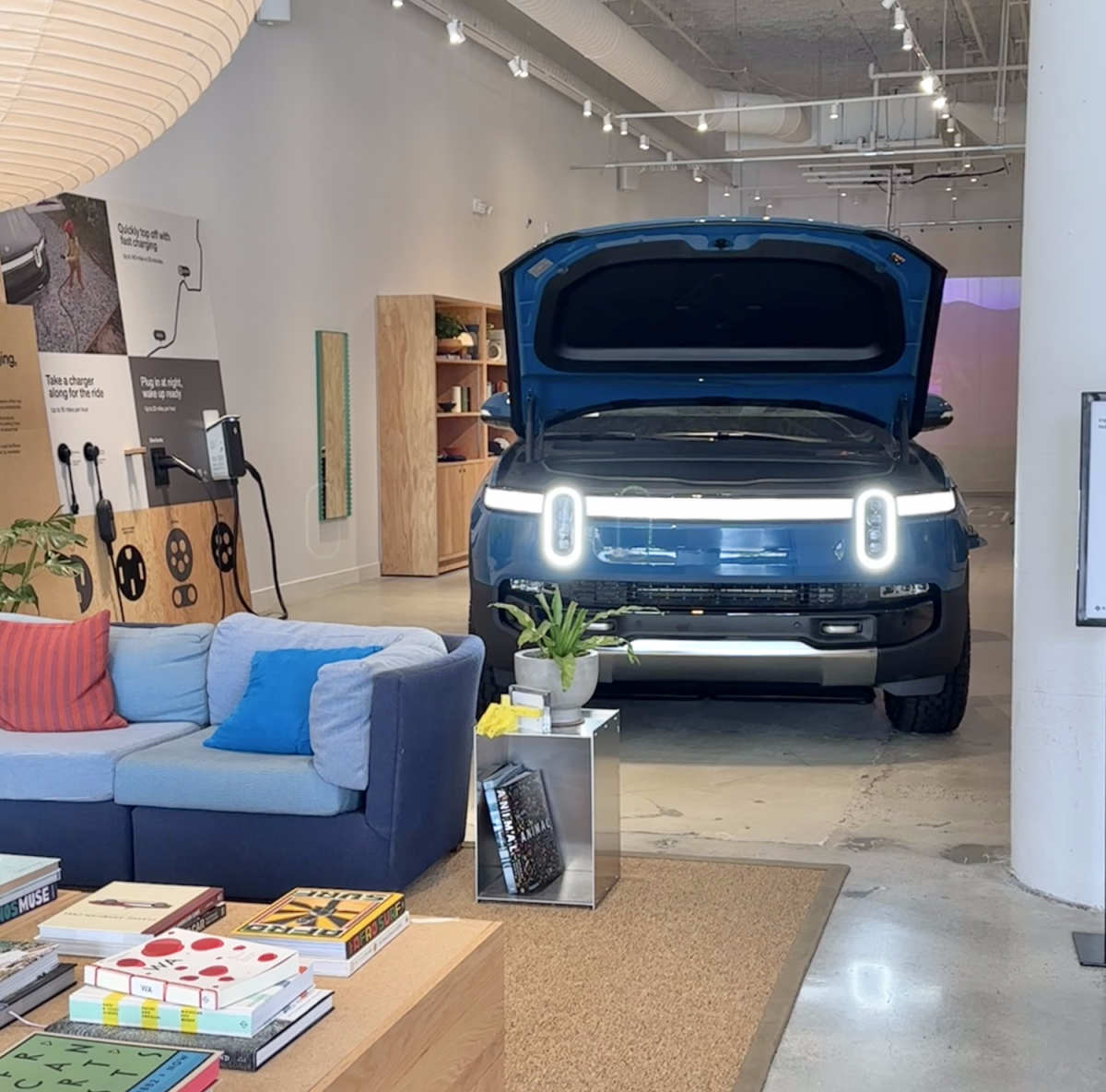 According to Rivian employee Stanford Davis, the Ponce City Market Showroom is more about an experience than simply selling cars. The space includes things from couches to coloring books, all constructed from sustainable materials.