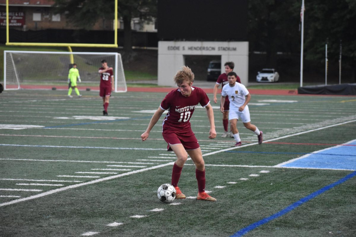 Senior striker JP Steiding dribbles up the field in the first the half during the Knights Elite Eight game against Eagles Landing on May 1. The Knights won 8-1. This Knights advanced to the Final Four losing to McIntosh.  