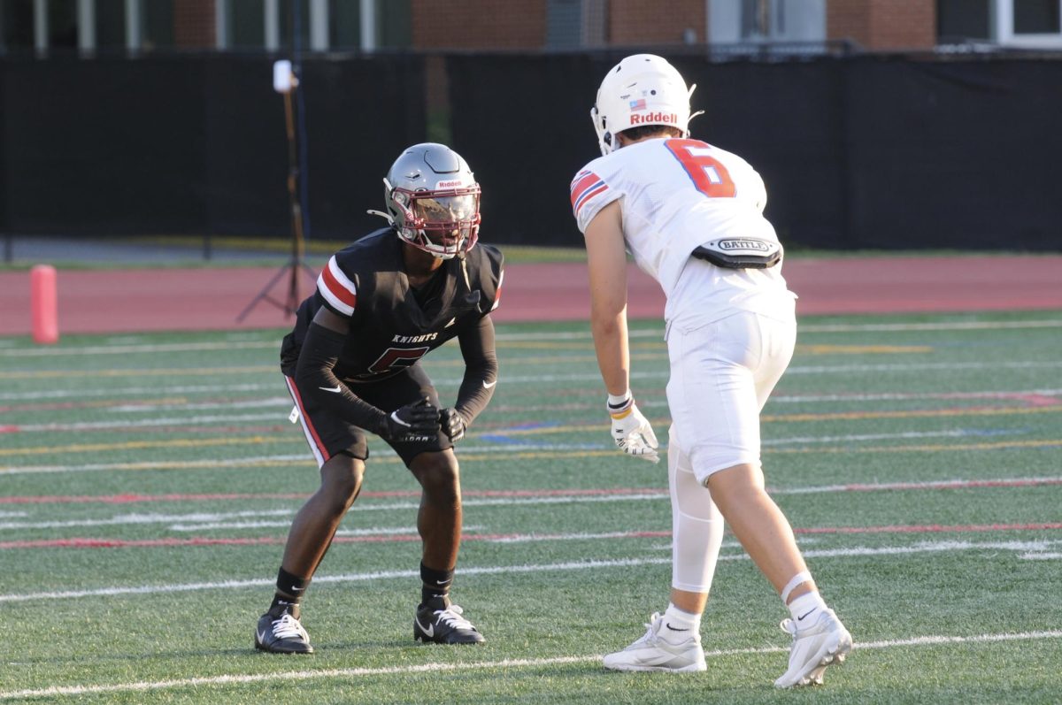 Junior cornerback Traevan Jones lines up against a Riverwood receiver in the fall scrimmage on August 8th. The Knights won 28-7 and Jones scored the Knights' first touchdown of the game on a 21 yard rushing touchdown.