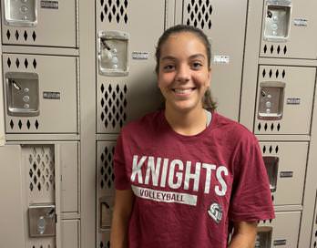 Freshman Grail Johnson in the locker room preparing for her volleyball practice.