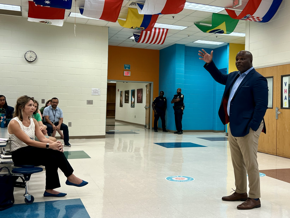 New superintendent, Dr. Bryan Johnson, addresses the crowd as he answers a question asked by a parent.