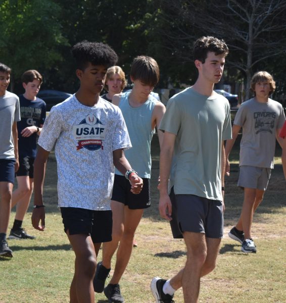 Junior Cameron Collier (left) and senior Daniel Reid (right) warming up to run a three-mile time trial around Piedmont Park on Aug. 12. The Knights placed fifth in the second APS weekly meet on Sept. 4. The Knights next run at the Wingfoot XC Classic.