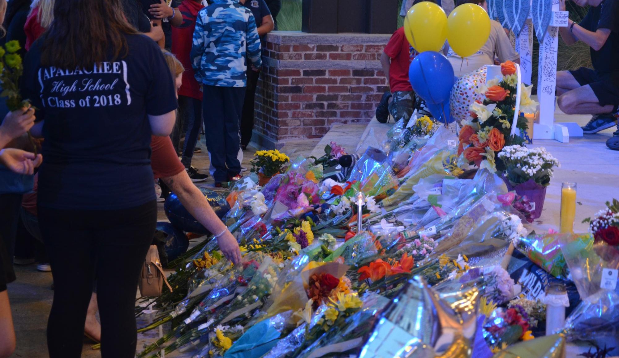 On Friday, Sept. 6, over 1,000 community members from Winder, Georgia attended a vigil at Jug Tavern Park to pay respect to the 2 teachers and 2 students killed in the Sept. 4 Apalachee school shooting. Attendees laid flowers in front of crosses for the four dead. 