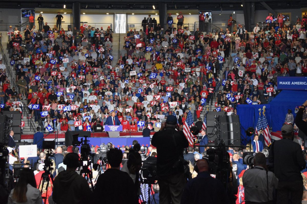 PRESS PRESENCE: As Trump took the stage, cameras fluttered to capture the former president's speech. Media coverage of this event brought national attention to Midtown Atlanta.