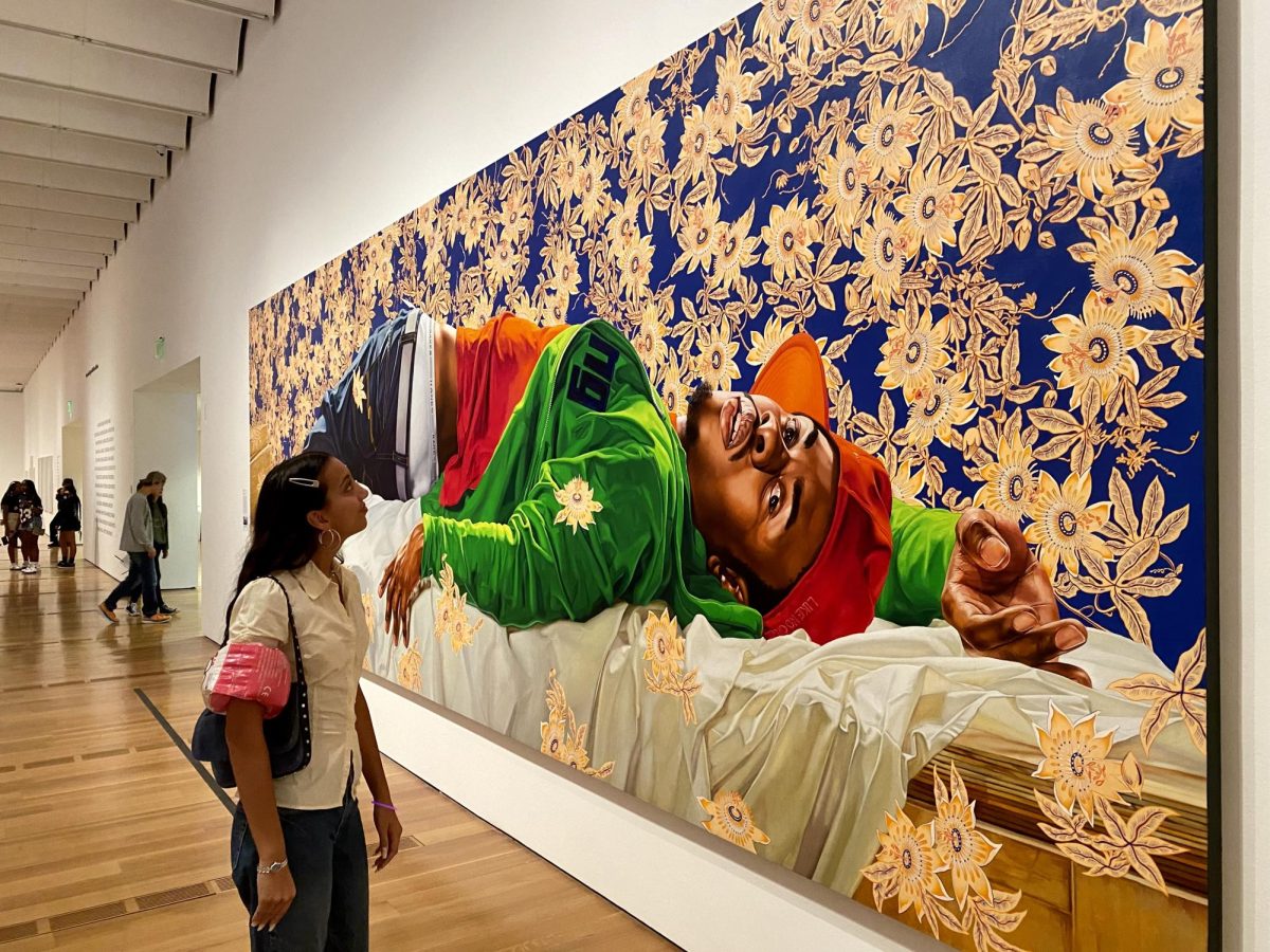 CULTURE IN BLOOM: At the Giants: Art from the Dean Collection of Swizz Beatz and Alicia Keys exhibit at the High Museum of Art, Senior Thalia Smith observes American painter Kehinde Wiley’s “Femme piquée par un serpent,” which portrays an African-American man posing as if he is the subject of a Renaissance painting.