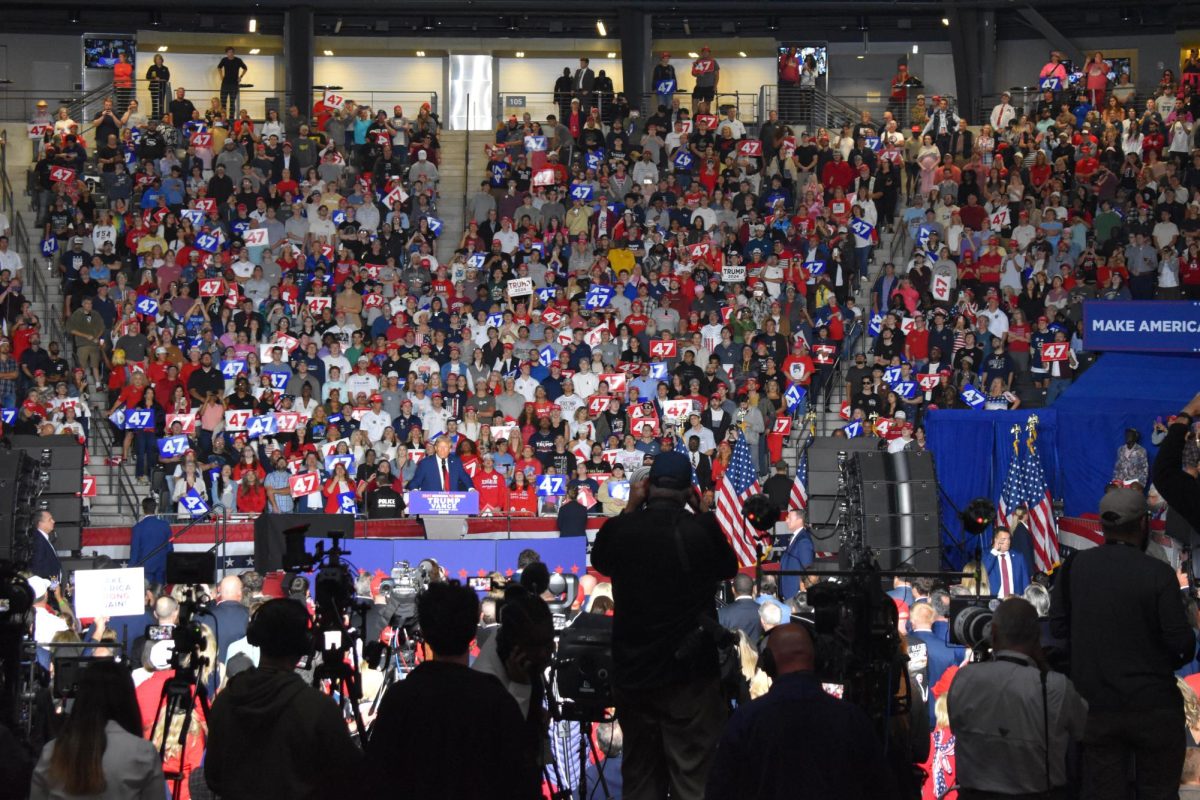 PRESS PRESENCE: As Trump took the stage, cameras fluttered to capture the former president's speech. Media coverage of this event brought national attention to Midtown Atlanta.