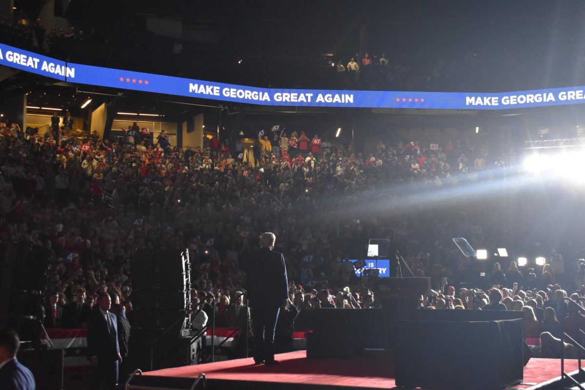 CALM CROWD: The crowd at the rally remained seated and quiet during speeches. Attendees were given signs to hold up when cheering. 