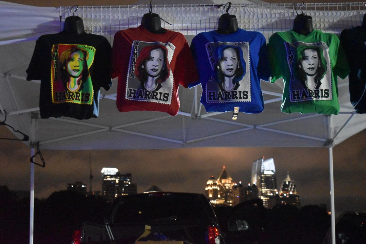 MERCH STANDS: Multiple vendors sold Harris merchandise in Piedmont Park outside the rally, where attendees could see the same view of the Atlanta skyline that Midtown students see from the stadium.