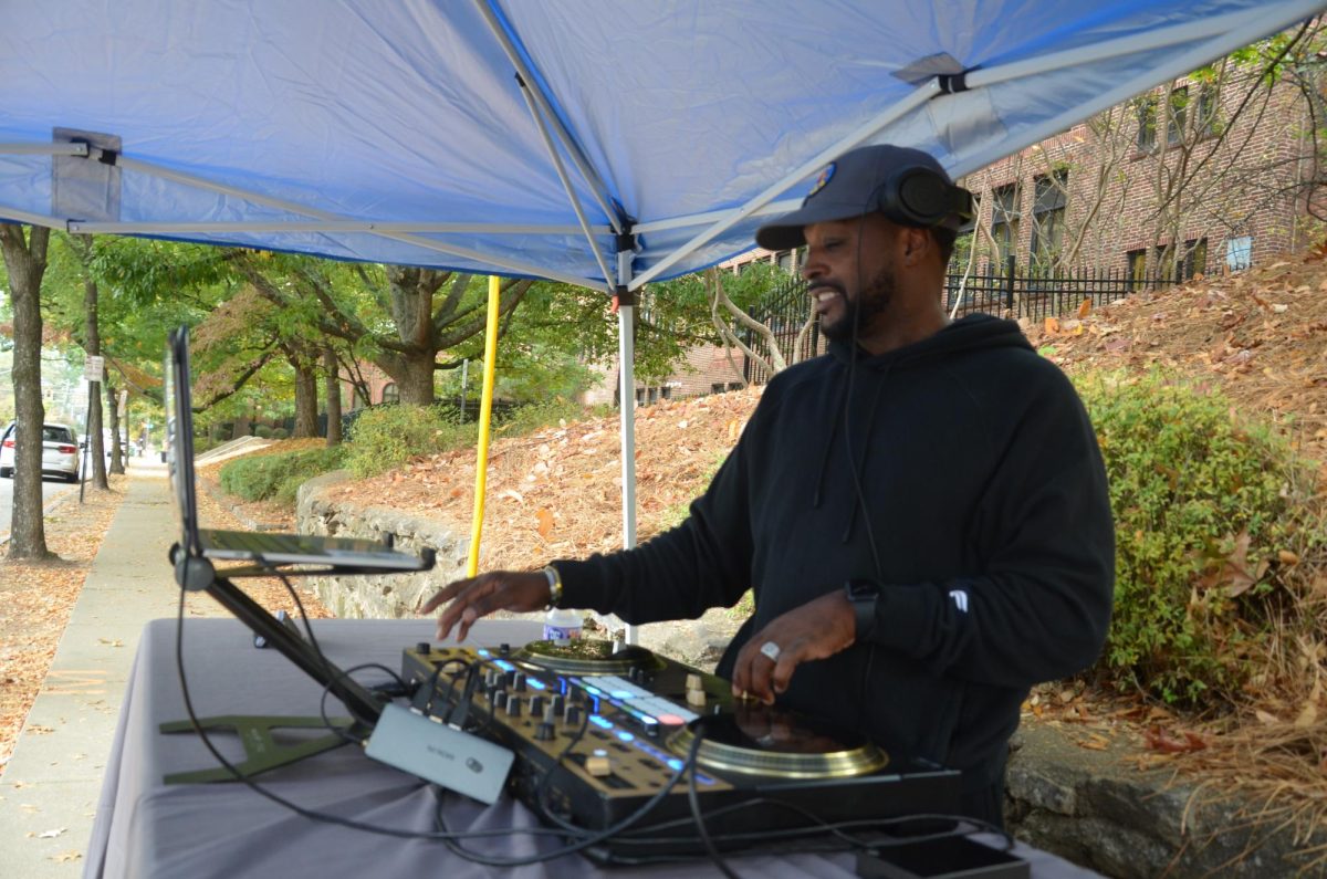 SPREADING THE WORD: DJ Waffles was on the sidewalk outside the voting location he was stationed at. From this location, he was able to communicate with community people and lead them to the polling location nearby.