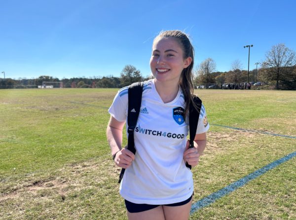 Junior Gigi Ret smiles before a soccer game.