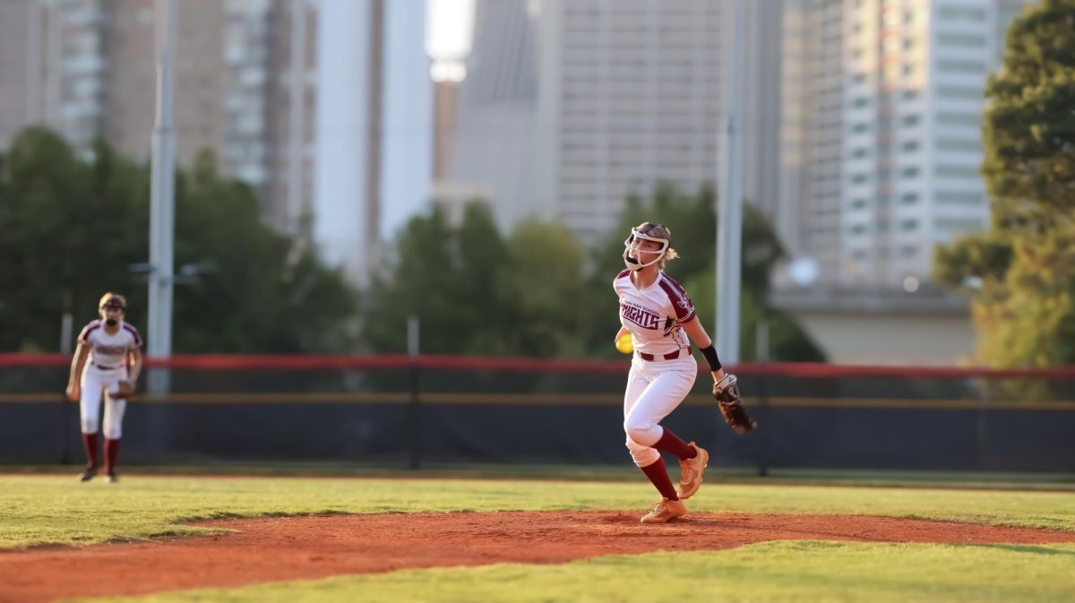 With a determined face, senior Megan Bookspun launches the pitch in the game against Pace Academy.