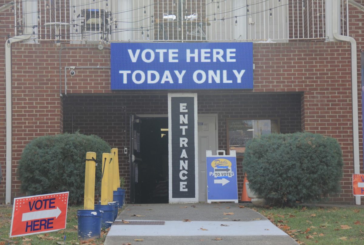 CONVINCING CITIZENS: Signs outside Dad's Garage urge citizens to vote at their location, which is open specially for Election Day. 