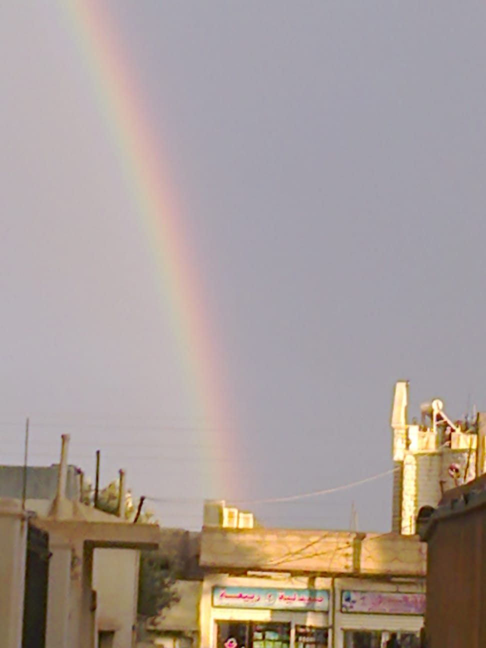 A rainbow shines over the city of Ar-Ruhaybah, Syria in September of 2012.