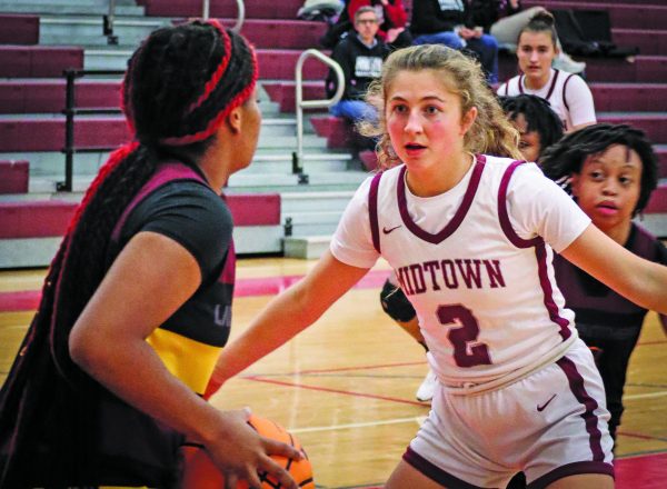 Senior Cate Barton defends a Forest Park player on Nov. 22, where the Knights won 100-8. The team is 10-2 overall and 4-2 in region. 