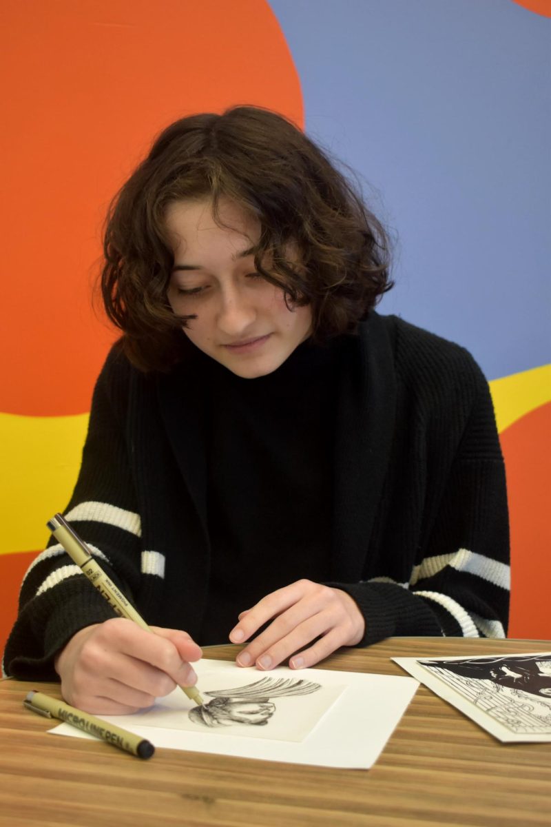 Junior Gabriela Waldman designs pages for the Latin Club's first coloring book, enjoying the opportunity to combine her interests for Latin stories and art. She encourages others to create their own submissions until Jan. 1 when the club begins to piece the book together.