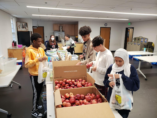 Midtown Students participate in a Snack in a Backpack event at Glenn Memorial Church. After the bags are packed, they are distributed to areas in need, which includes APS cluster Hope Hill Elementary School.