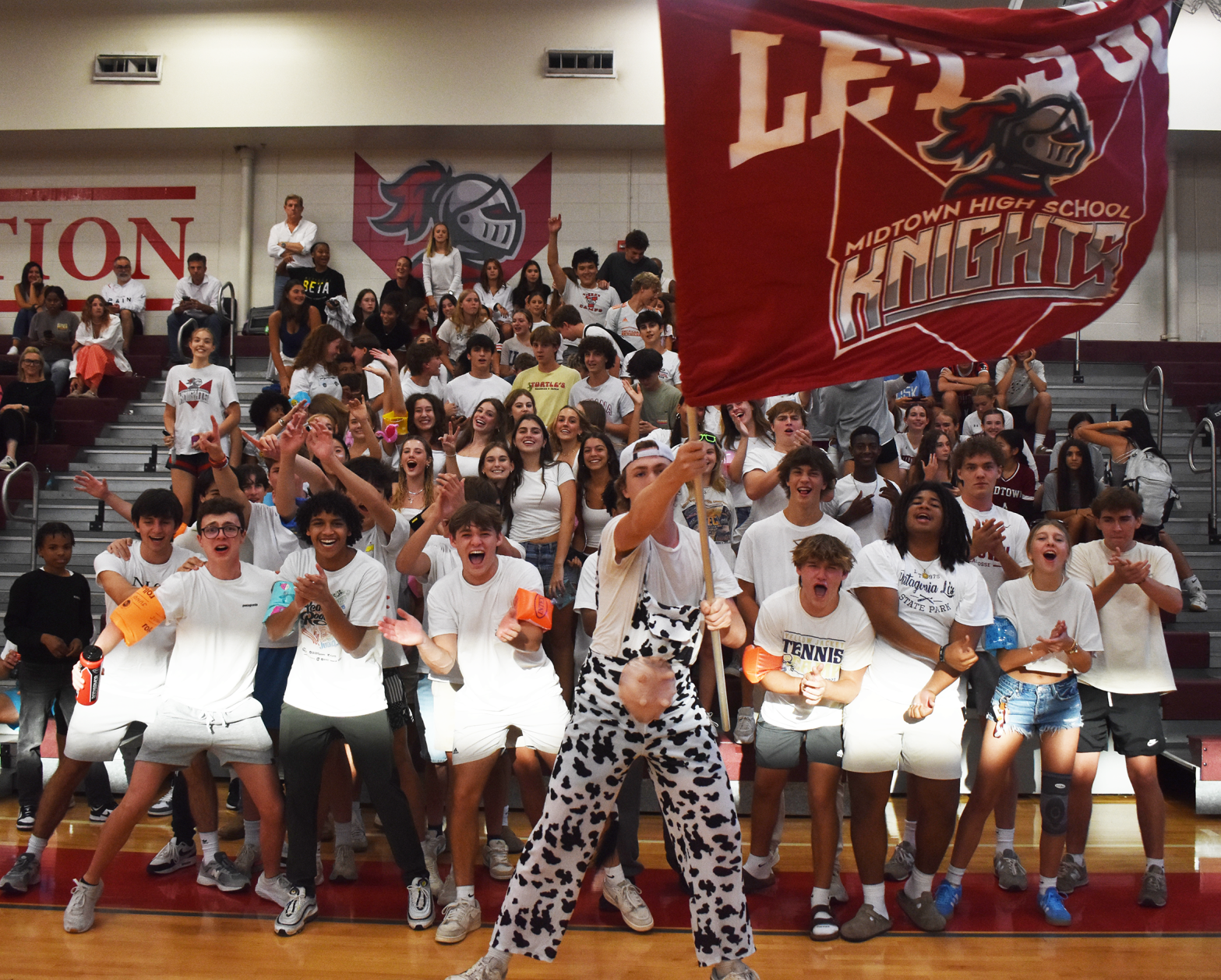 Senior Ward Rentz-Baker leads the Dungeon student section in a volleyball game. The "Dungeon" was formed this year and has impacted Midtown home game atmospheres.