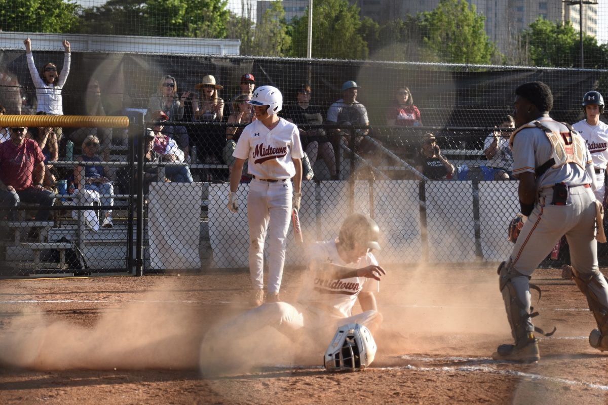 Senior Harrison Briggs slides into home plate to score the Knights' first run of the game. Briggs said the team improved massively this year in multiple areas. 
"[Compared to last year,] we can hit better, and we definitely have more depth at pitching," Briggs said. 
