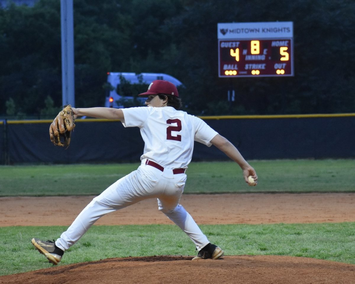 Senior Quinn Fischel throws the final pitch of the Knights' rivalry game against Jackson. The full count pitch led to a groundball to win the game for the Knights 5-4.