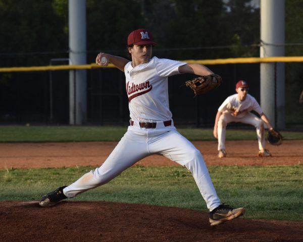 Senior Quinn Fischel throws a pitch in the sixth inning of Midtown's rivalry game against Maynard-Jackson on April 15. The Knights won 5-4 and Fischel was credited with the pitching win.