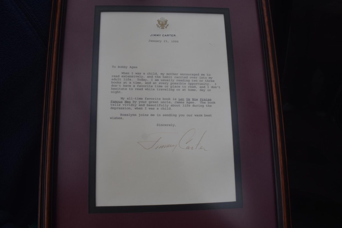 When President Jimmy Carter found out Bobby Agee, who worked at Manuel's Tavern, was related to James Agee, the author of his favorite book, "Let Us Now Praise Famous Men," Carter signed a copy of the book and wrote a letter to Bobby, explaining its significance in his life. The next time Carter visited Manuel's, Bobby visited his table to thank him for the letter. Carter ended up inviting him to sit down while he told the story of a documentary he made in his backyard in Plains about James Agee.